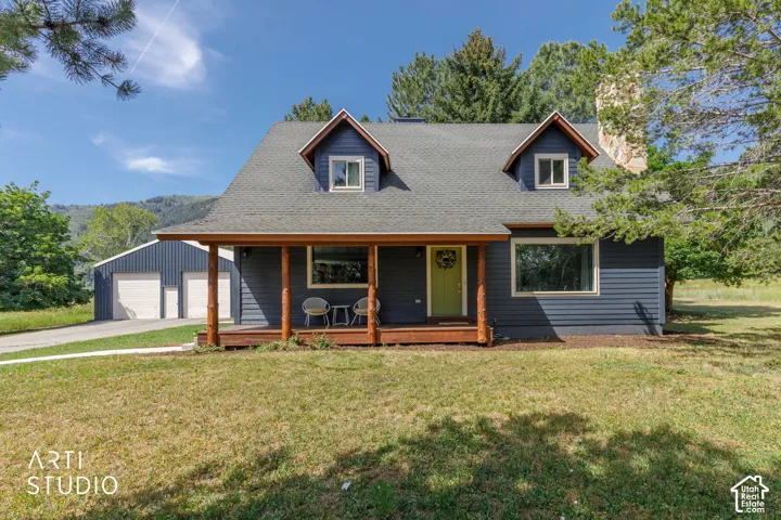 Blue siding facade with a covered porch featuring natural wood posts