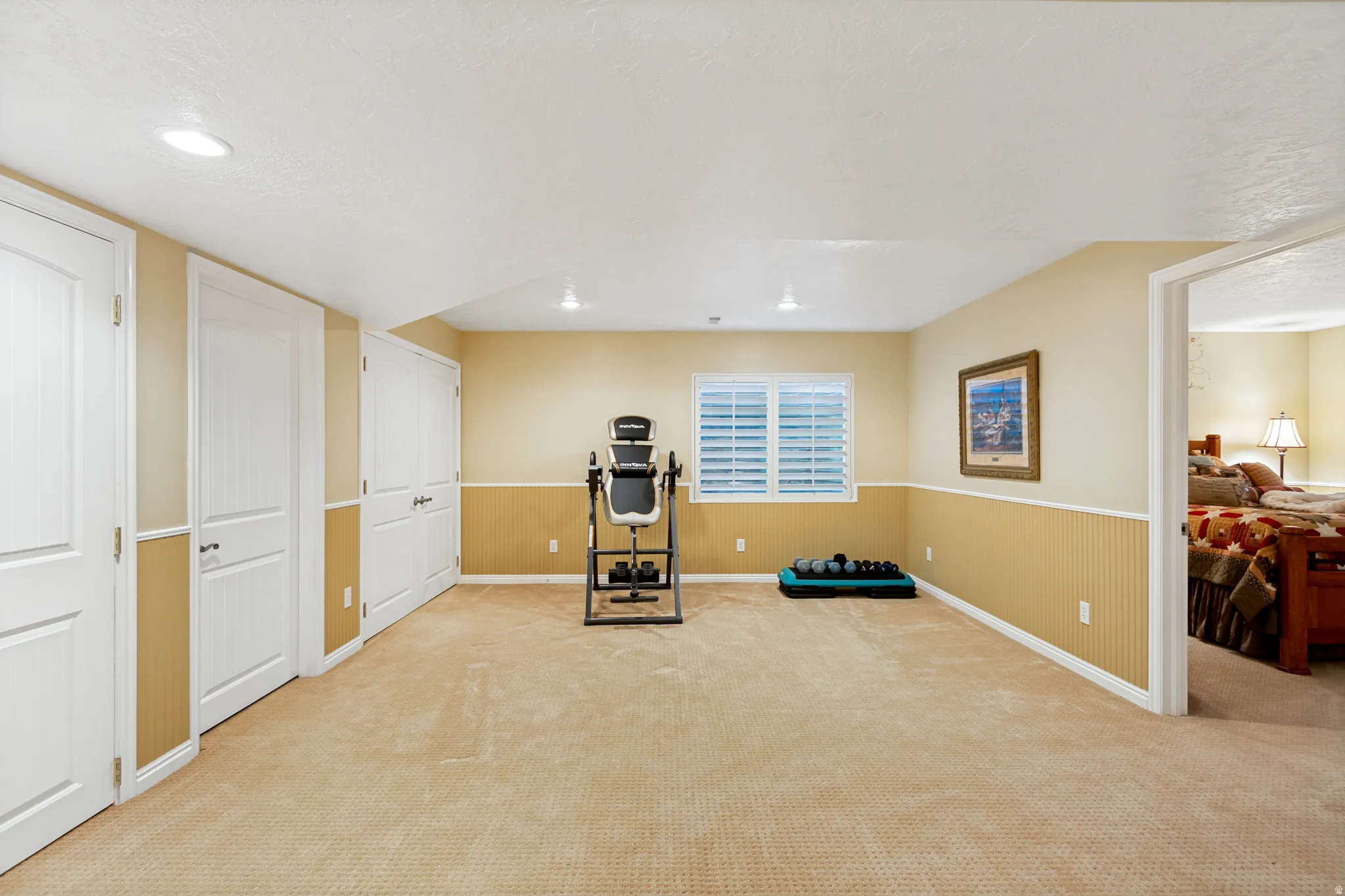 Open flex space featuring carpet flooring and recessed lighting