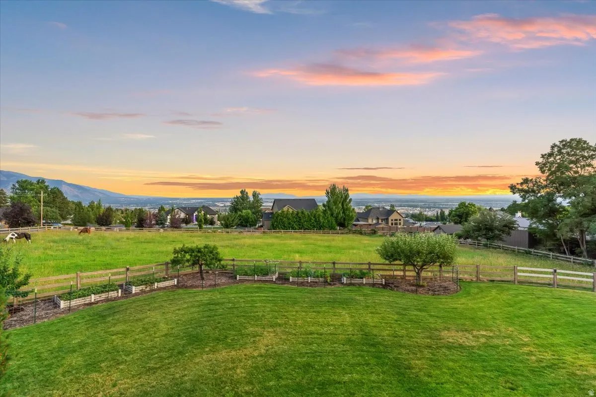 Expansive green lawn with mountain backdrop