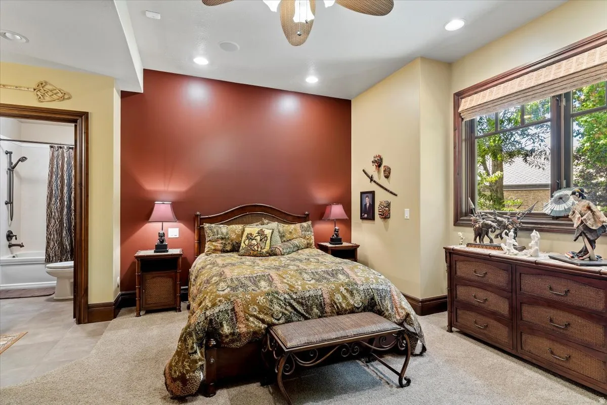 Carpeted room with a full window offering exterior views