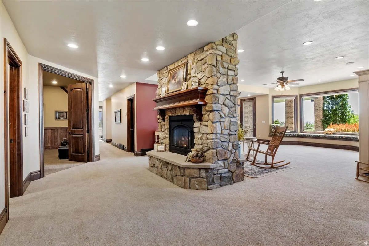 Stone-clad fireplace with a wood mantle