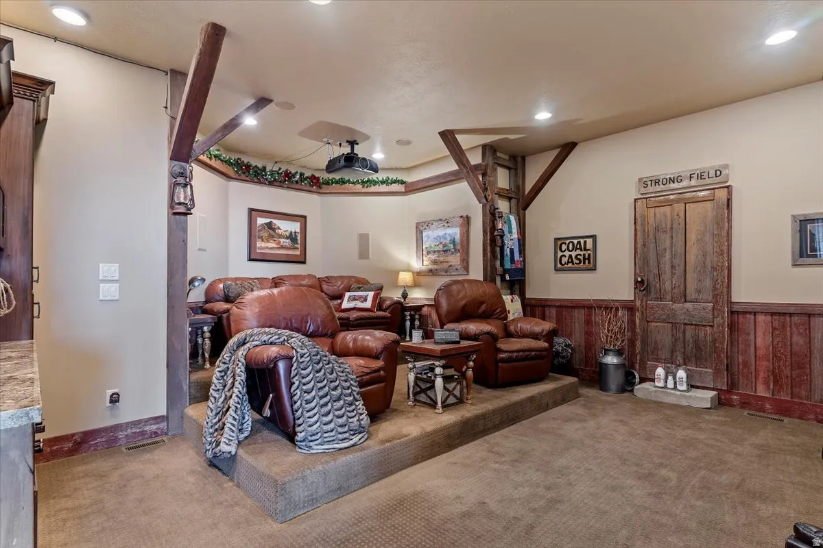 Dedicated media room with tiered seating. Featured beams & wood from 100 year old barn.