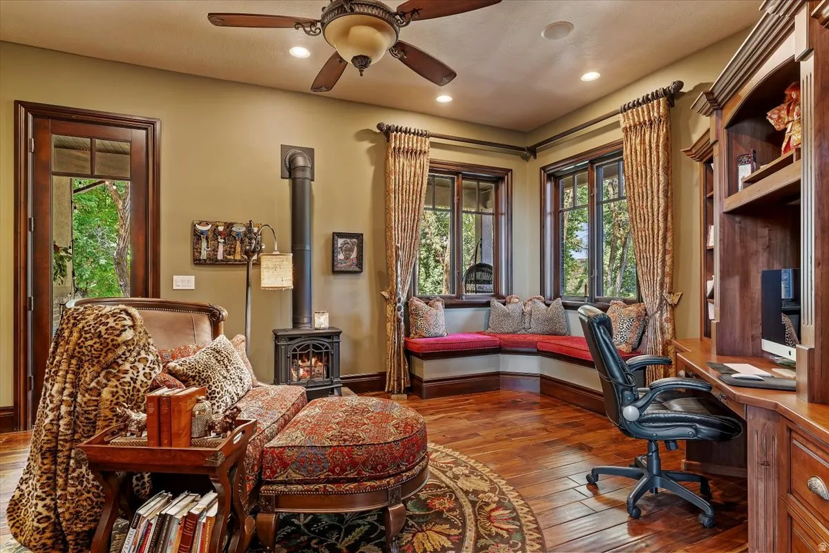 Warm wood-finish flooring complements the built-in desk and cabinetry
