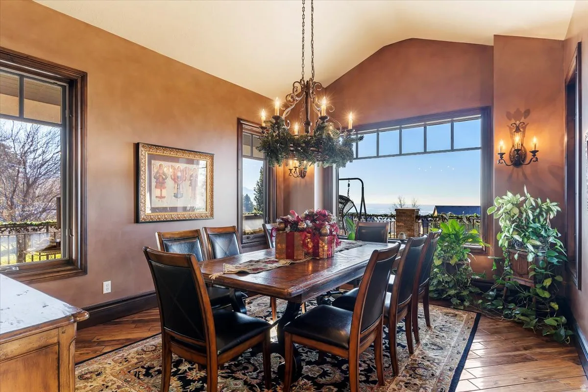 Dining space featuring wide plank wood-finish flooring, a walk out to a generous covered deck featuring ever-changing views of valley and mountain.