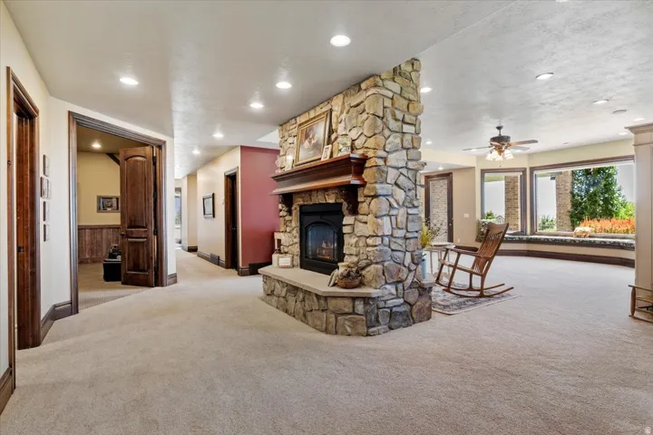 Stone-clad fireplace with a wood mantle