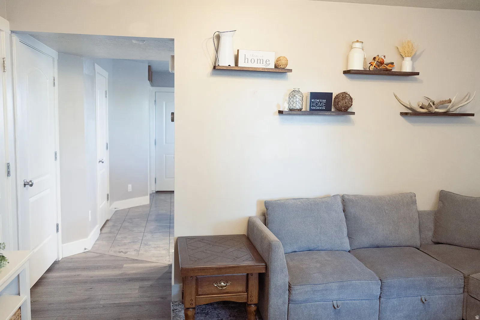 Interior wall featuring floating wood shelves