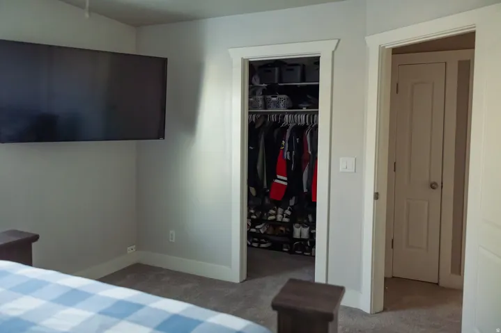 Plush carpeted flooring complementing light gray wall tones