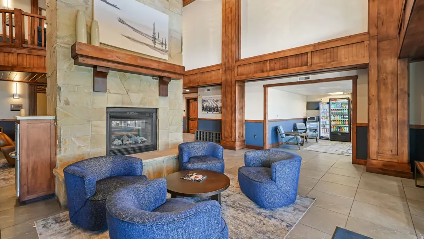 Stone fireplace with a substantial wood mantel