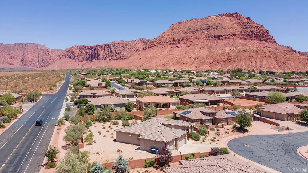 Expansive residential neighborhood featuring single-story homes with tile roofs, surrounded by arid landscaping
