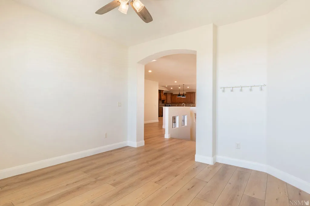 Open concept interior featuring light wood-finish flooring