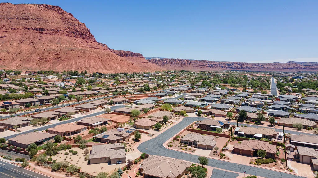 Expansive residential area with a distinctive red rock mountain backdrop