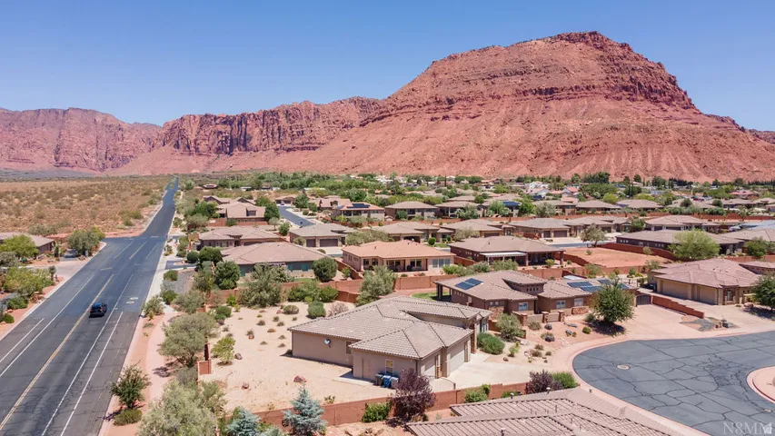 Expansive residential neighborhood featuring single-story homes with tile roofs, surrounded by arid landscaping