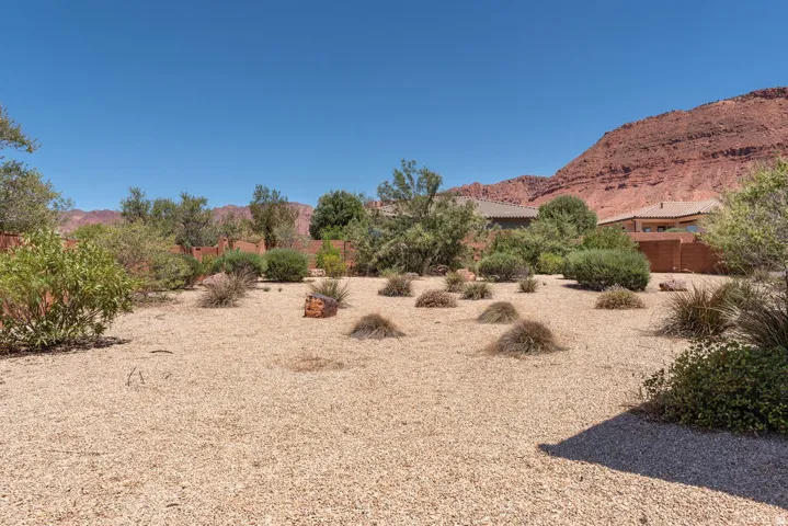 Xeriscape-style yard with gravel landscaping and varied shrubbery