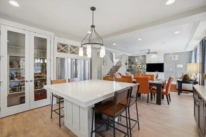 Open-concept kitchen and living area featuring wood-finish flooring