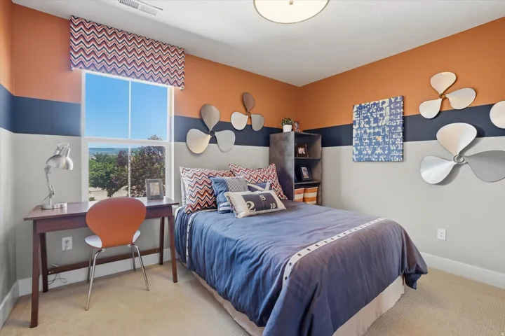 Bright room featuring a large single-pane window with a patterned valance