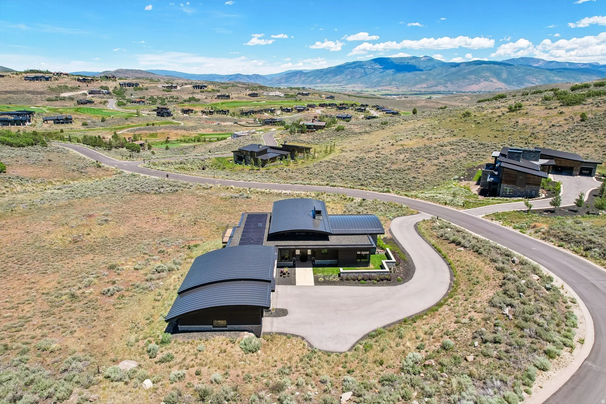 Contemporary architecture featuring a distinctive curved roofline