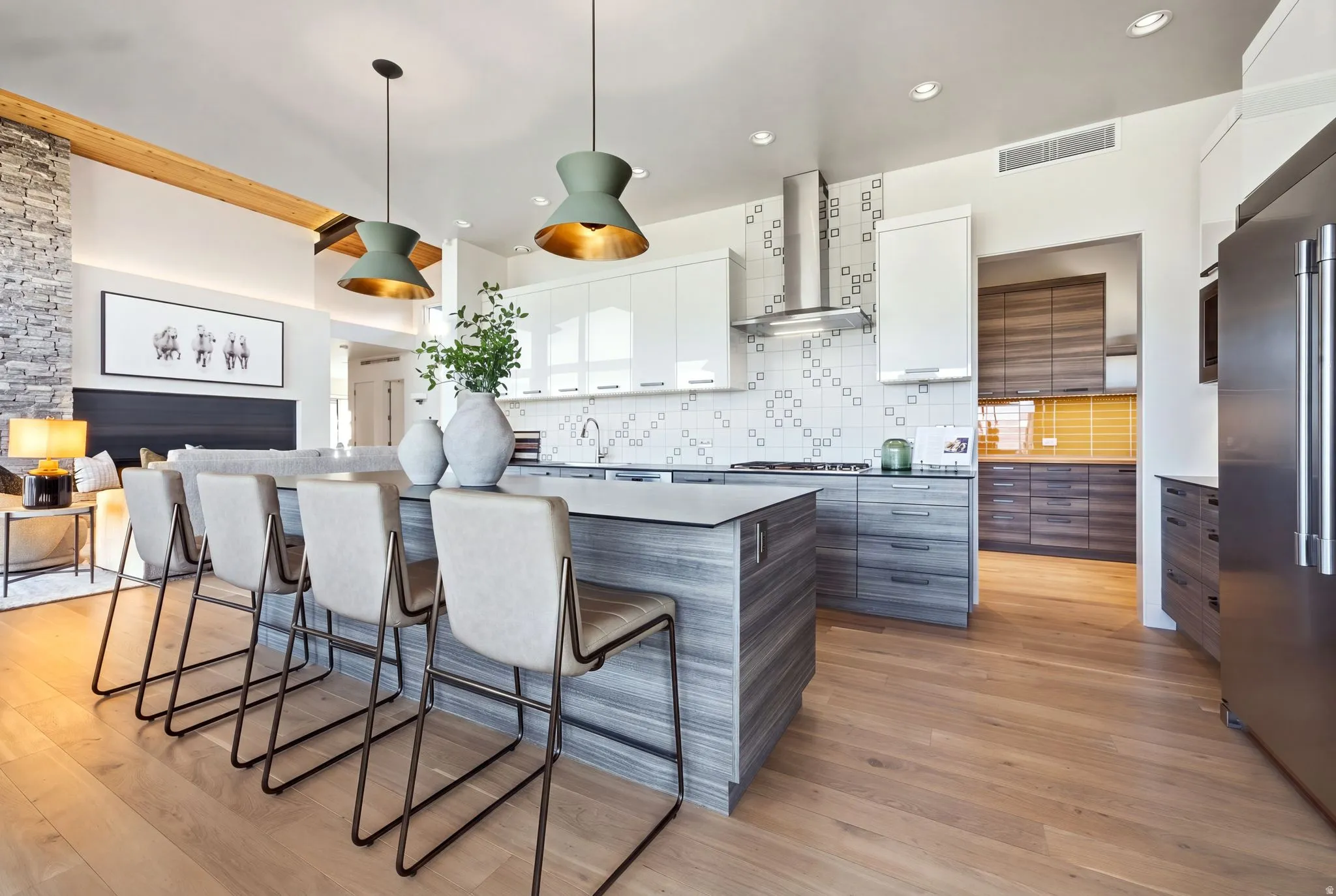 Expansive wood-finish flooring throughout