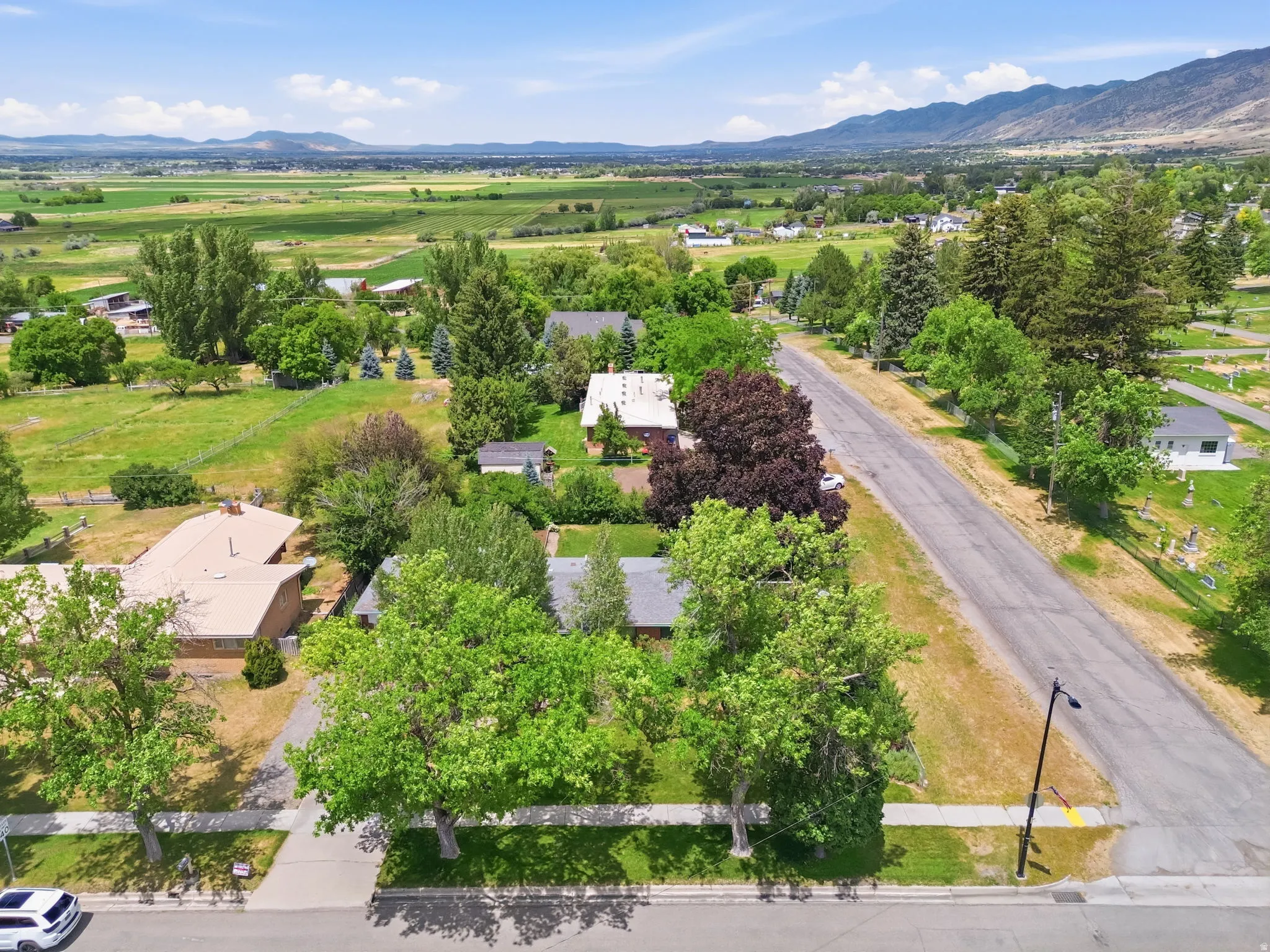 Aerial perspective showcasing the surrounding landscape with distant mountains