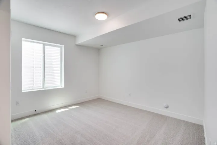 Neutral-toned carpeting paired with white walls