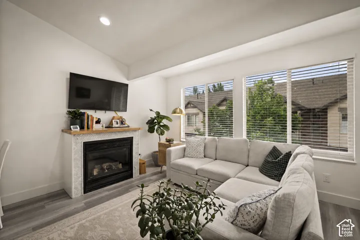 Living area featuring a gas fireplace with a mosaic tile surround and a wood mantel
