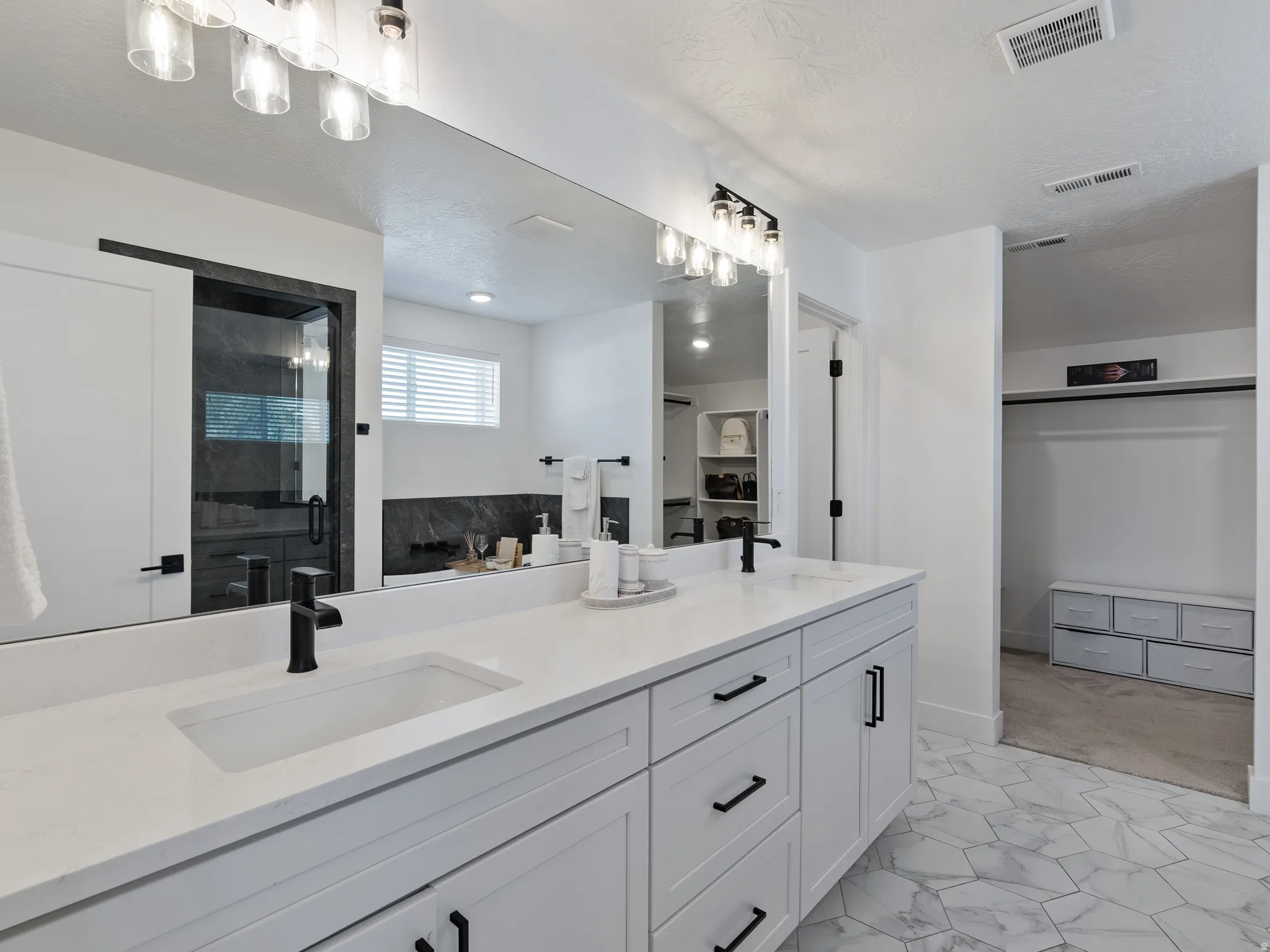 Dual vanity with integrated sinks and matte black fixtures