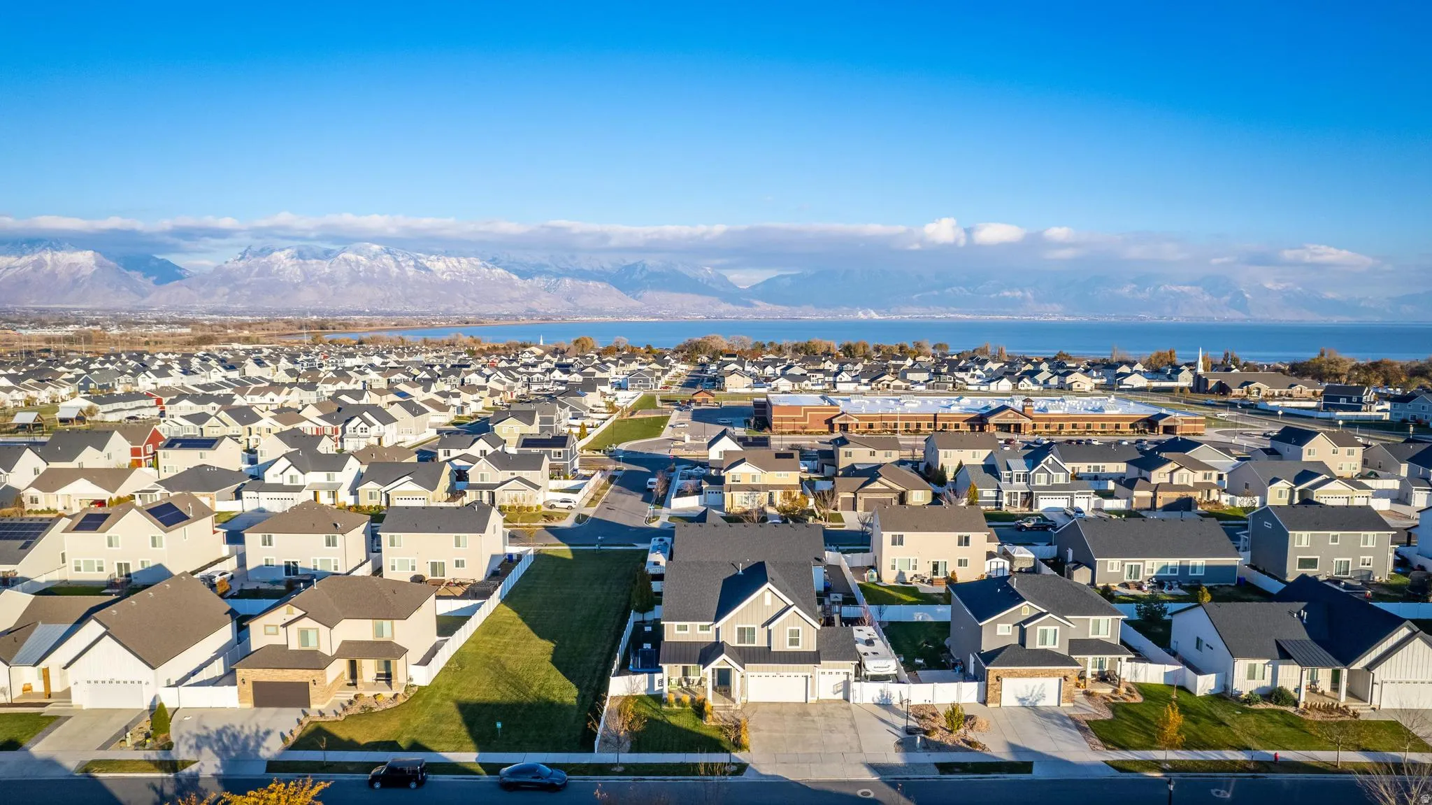 Expansive residential neighborhood featuring numerous single-family homes with diverse architectural styles, visible streets, and green spaces