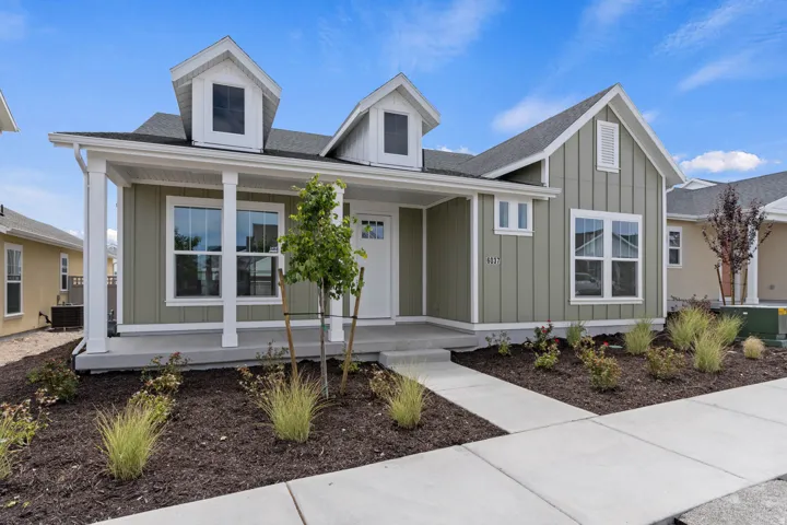 Contemporary ranch-style residence featuring vertical board and batten siding