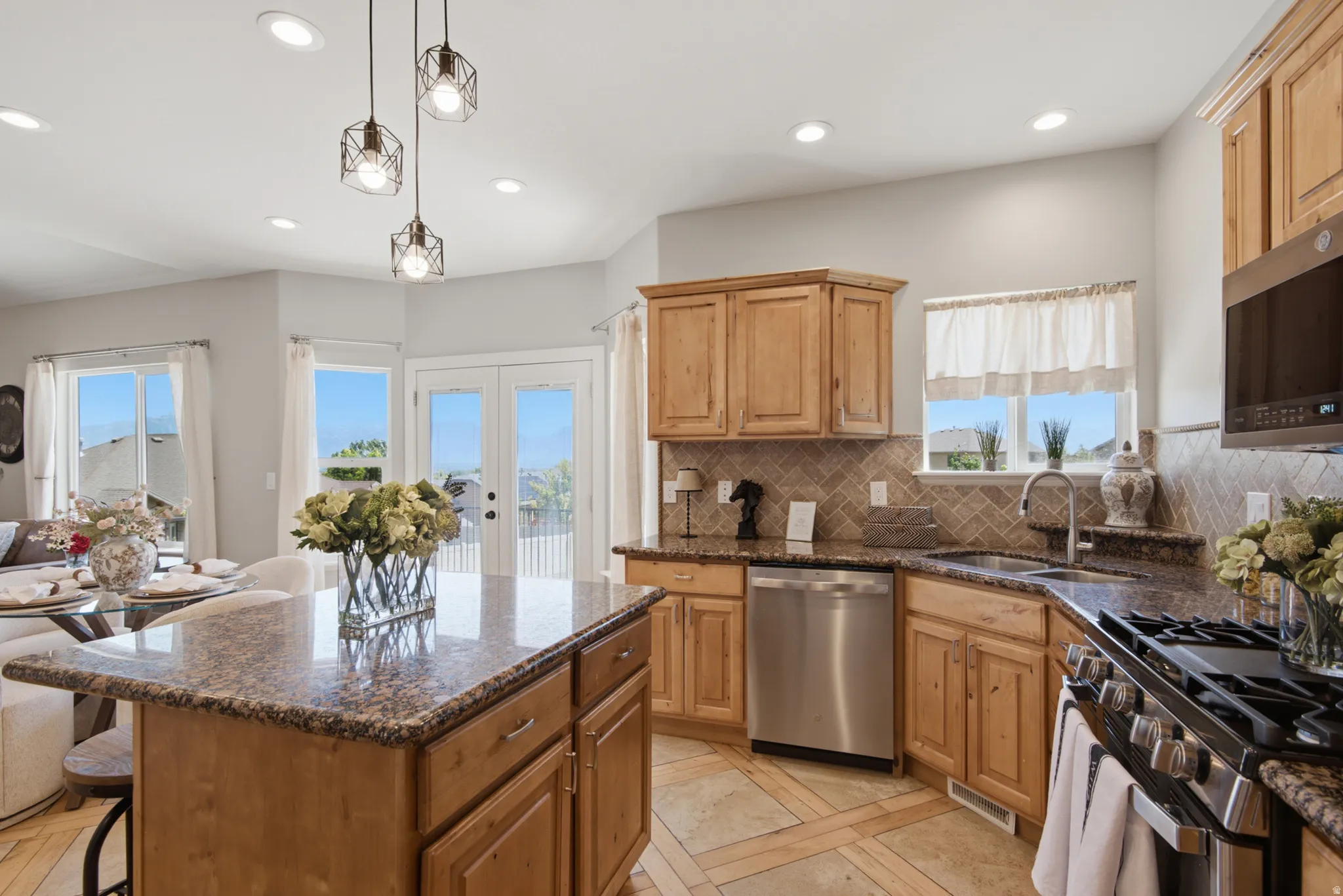 Kitchen featuring wood cabinetry, granite countertops, and stainless steel appliances