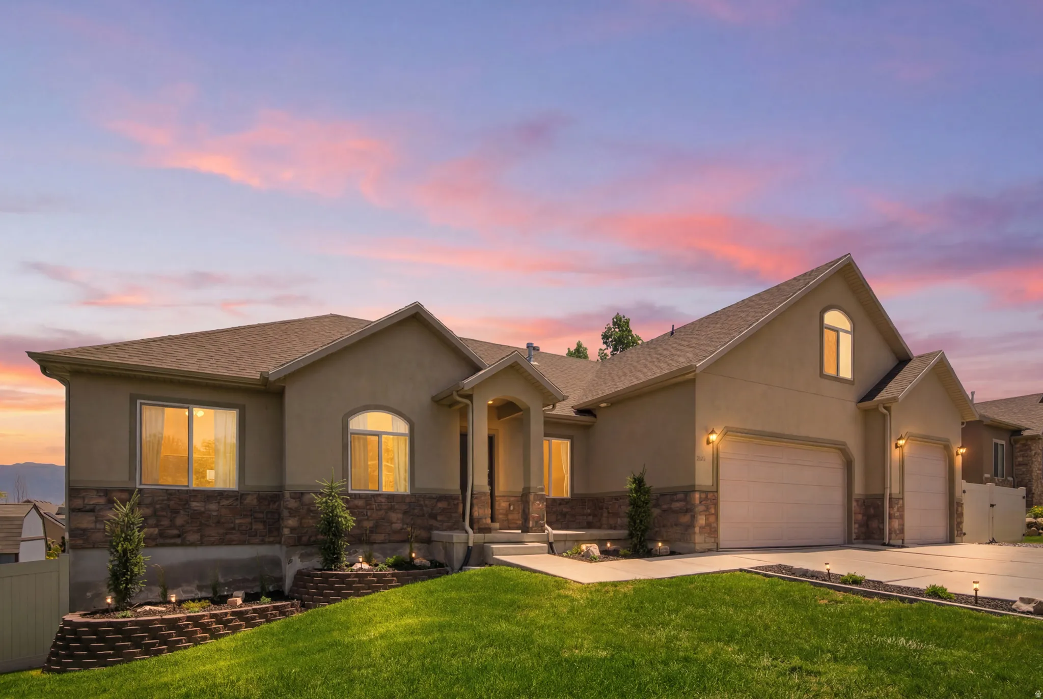 Contemporary stucco exterior with stone accents