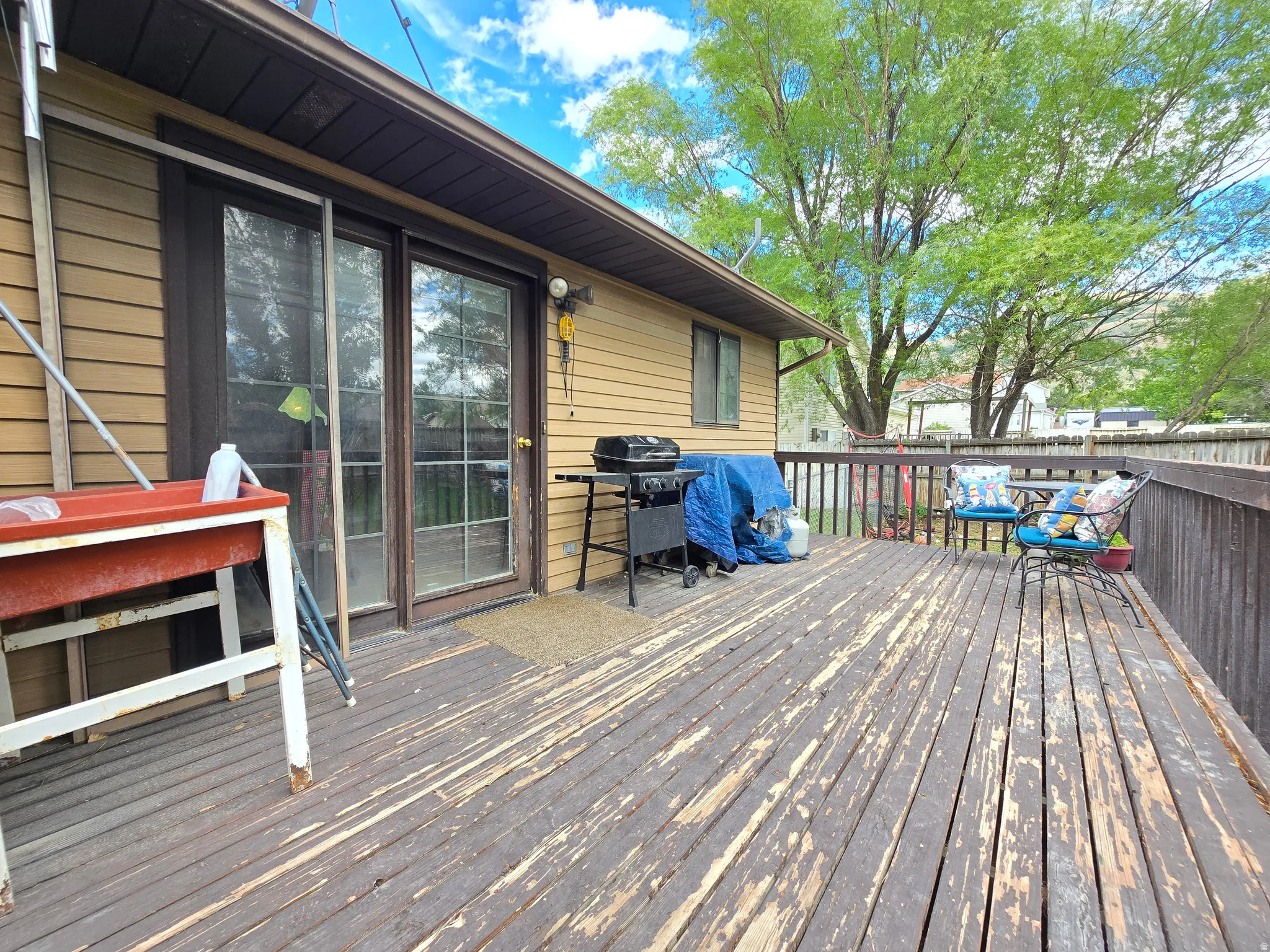 Spacious outdoor deck featuring wood flooring and a perimeter railing