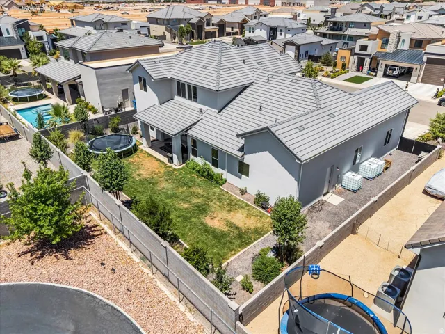 Contemporary two-story residence featuring a gray exterior and a concrete tile roof