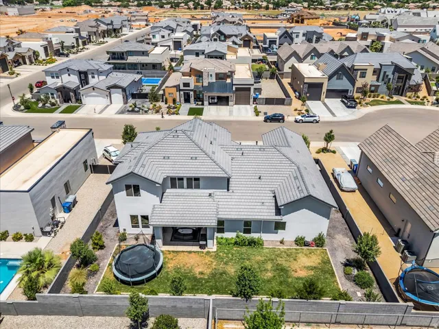 Gray tile roof with multiple gables and a covered patio area