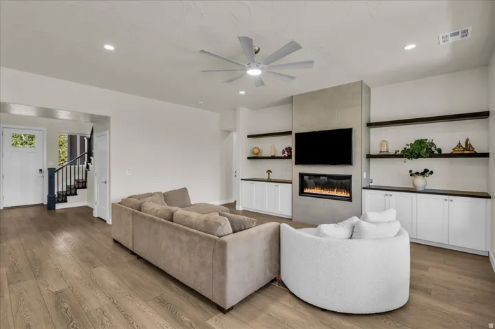 Open-concept living space with wood-finish flooring