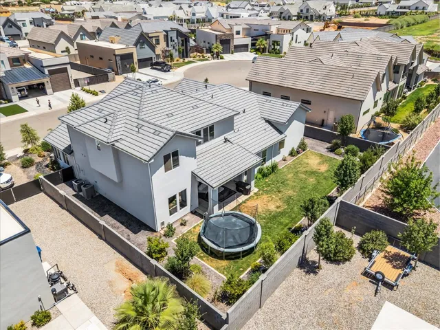 Contemporary residence with a light-toned exterior and a multi-gabled roof