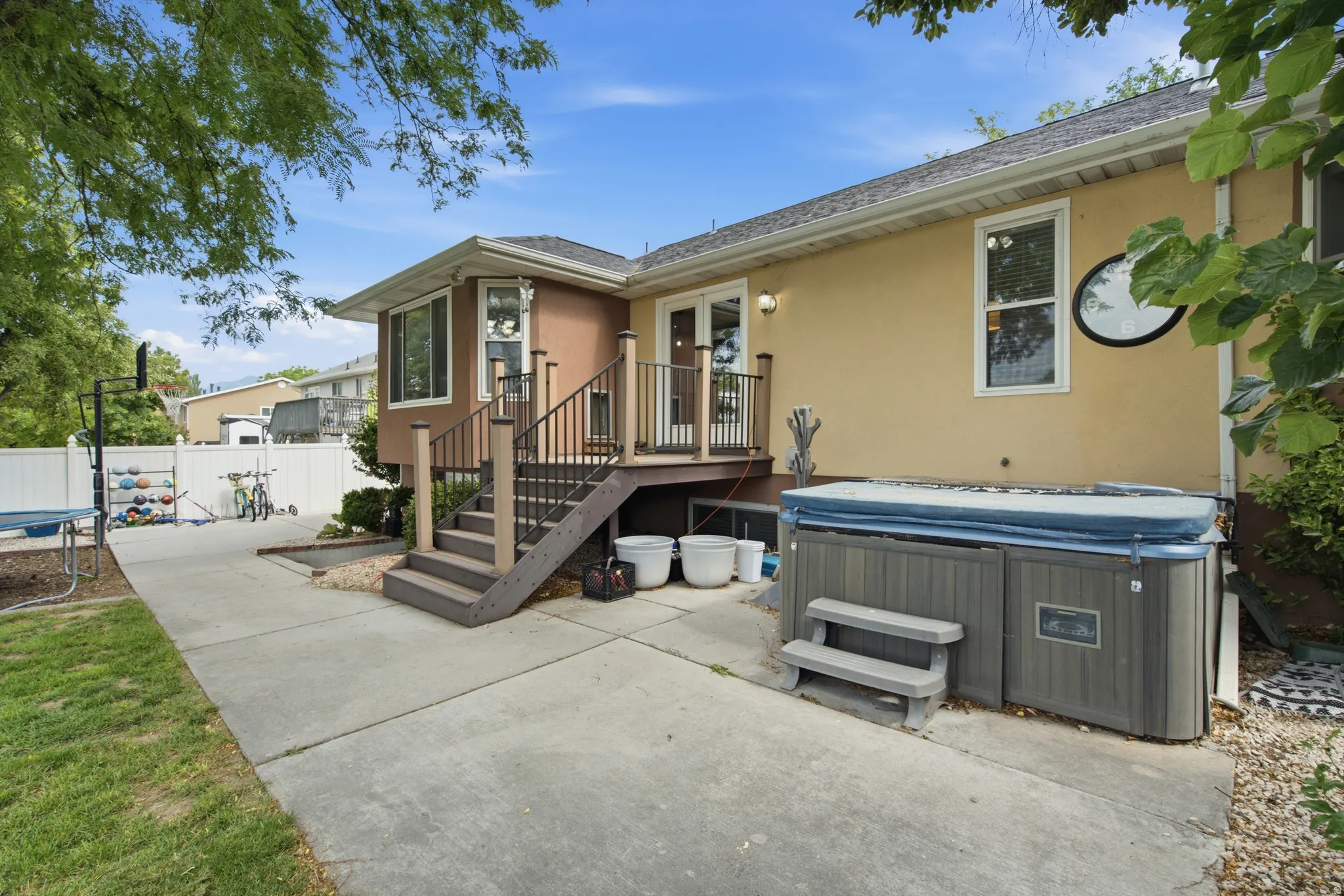 Exterior featuring a multi-level deck with composite steps and metal railings