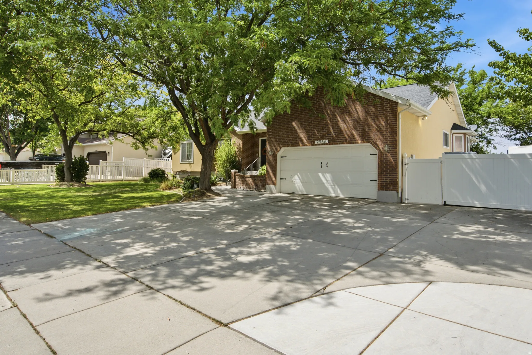 Brick and stucco exterior with a two-car garage