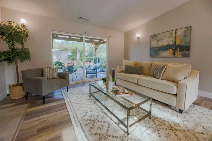 Sliding glass doors provide access to the outdoor patio