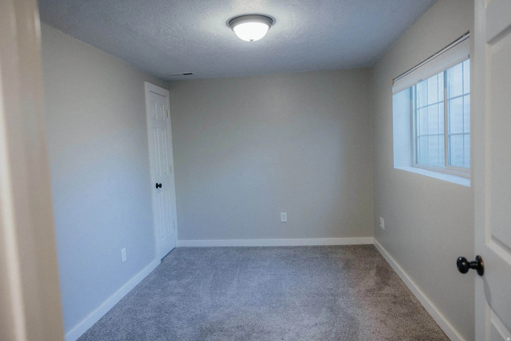 Bedroom #4 has a large window that lets in plenty of light.