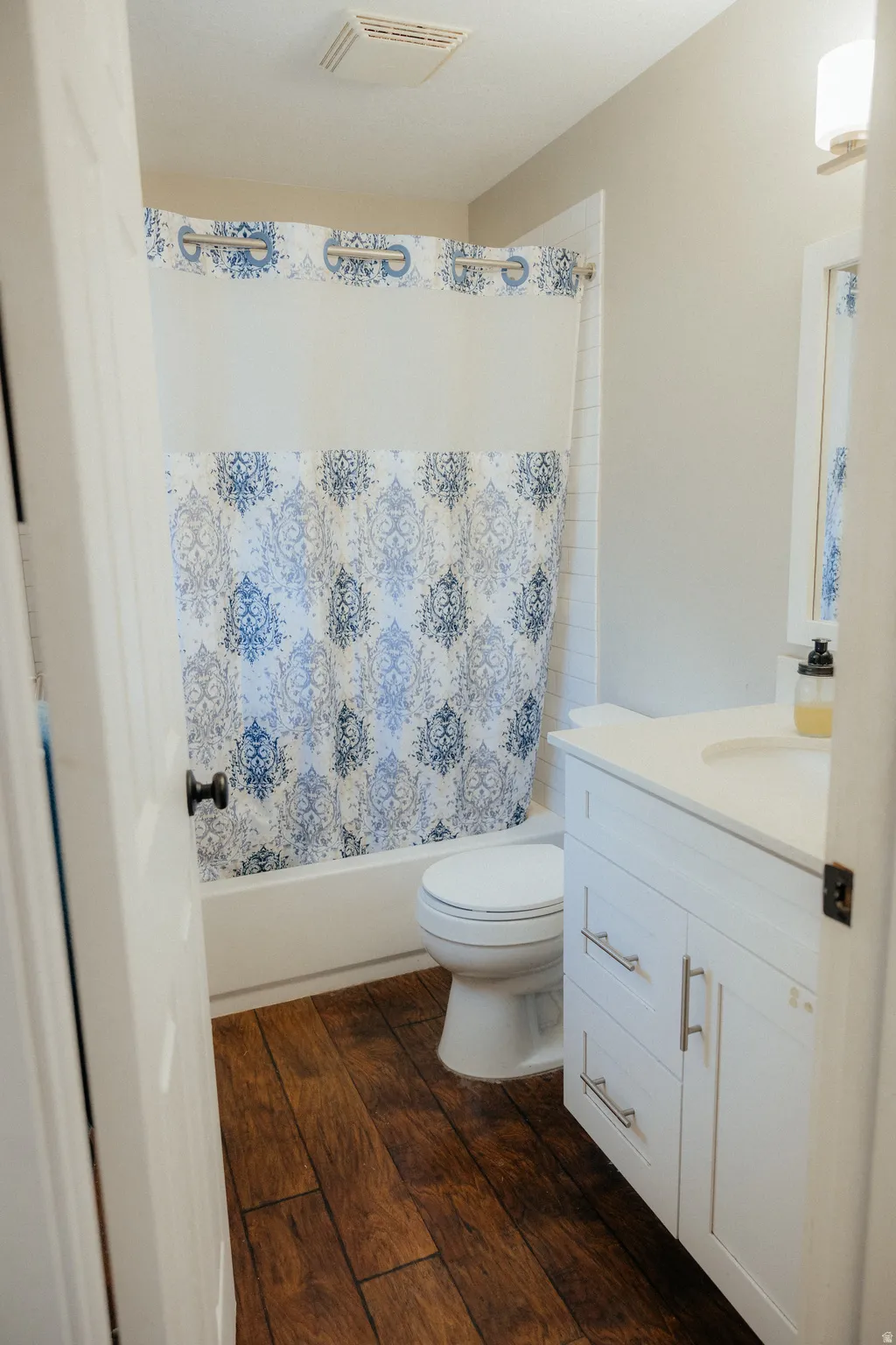 The ensuite bathroom is cheery and bright.
