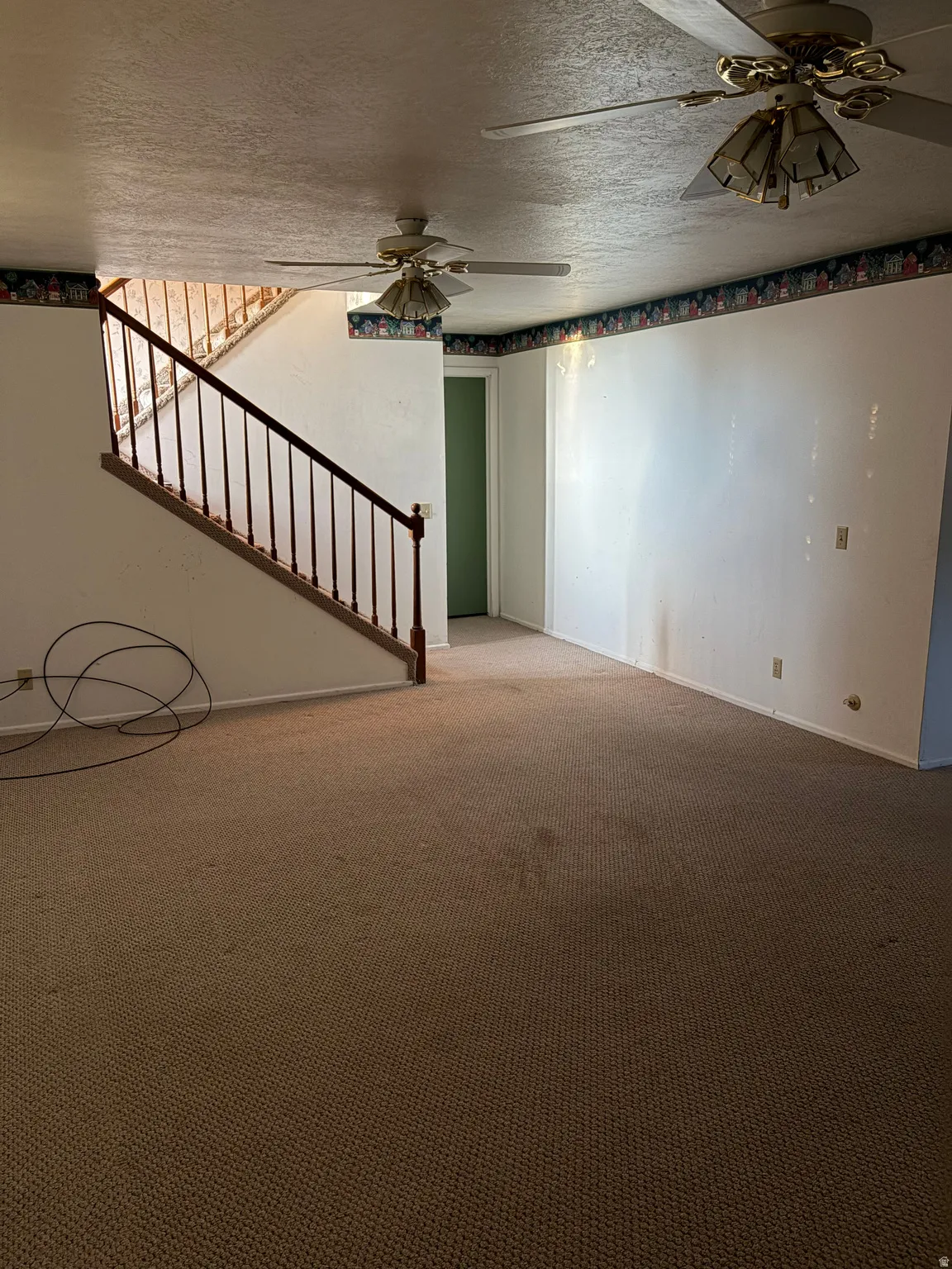 Carpeted flooring extending throughout the space