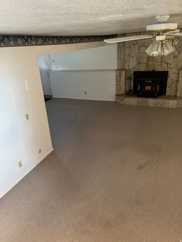 Stone-clad fireplace with a built-in insert
