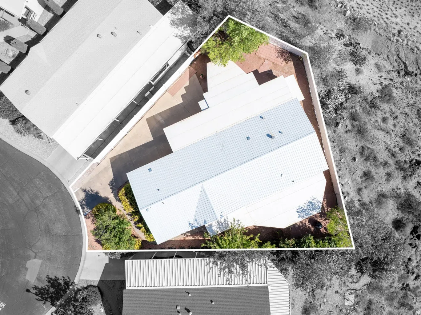 Aerial view of the property with a white perimeter outline