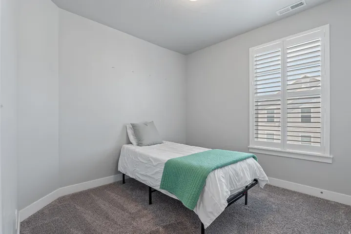 Room featuring wall-to-wall carpeting and white baseboards