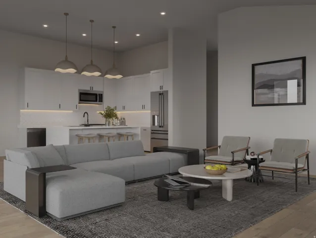 Living area featuring light wood finished floors, a high ceiling, and recessed lighting