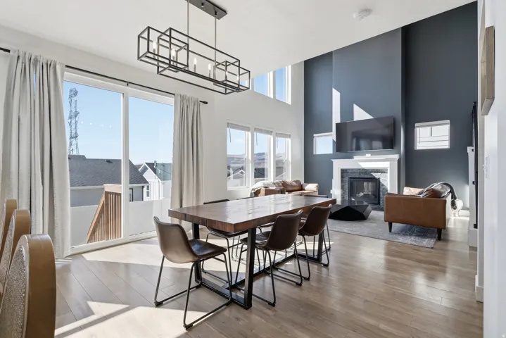 Open-concept living area with light wood-finish flooring