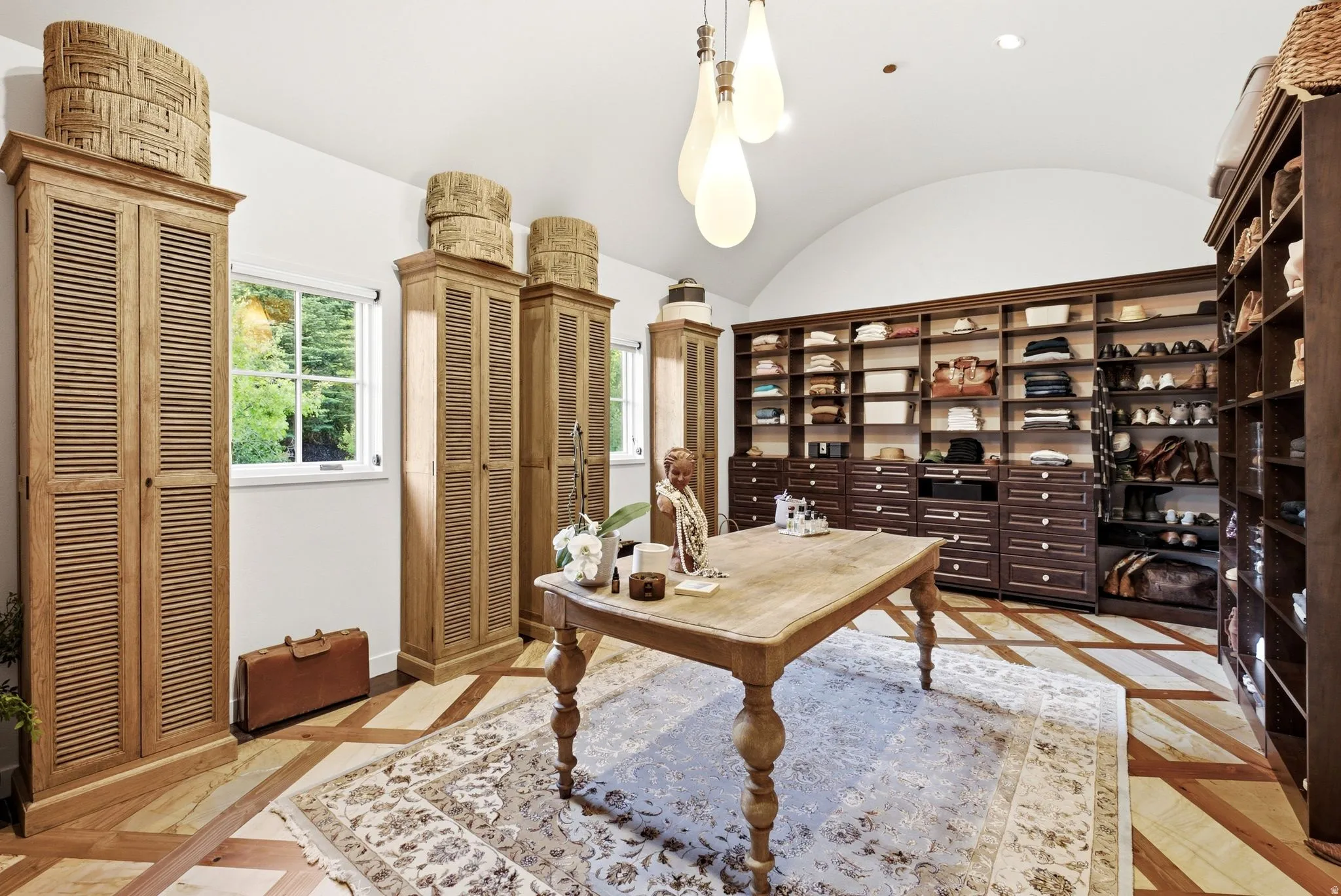 Custom closet room featuring extensive built-in shelving and drawer storage