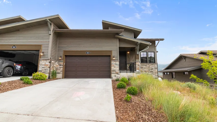 Contemporary exterior featuring horizontal siding and stone accents