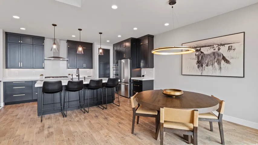 Open-concept living space with wood-finish flooring