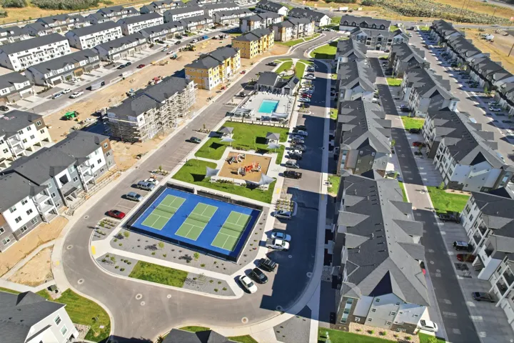 Community amenities featuring a tennis court, swimming pool, and children's play area