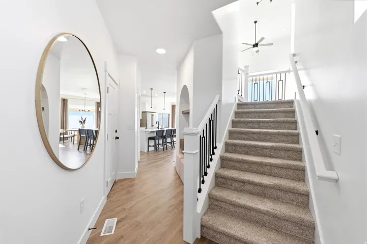 Light wood-finish flooring extending from the entryway